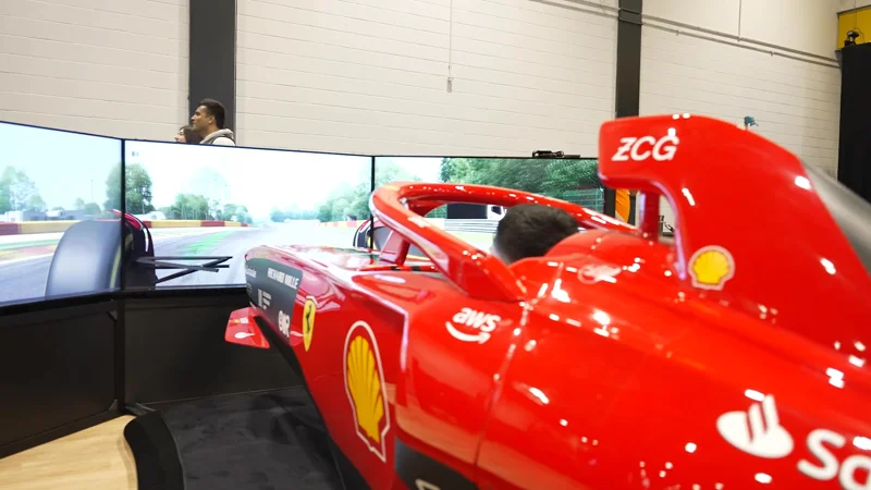 A red Formula One car on an exhibitor stand