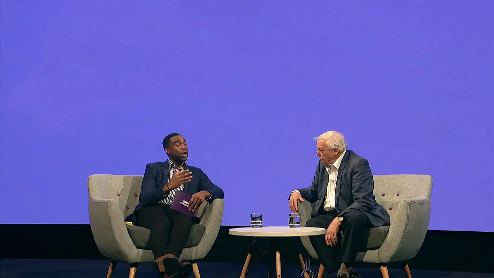 BBC Studios stage with two presenters in discussion being filmed for a video production